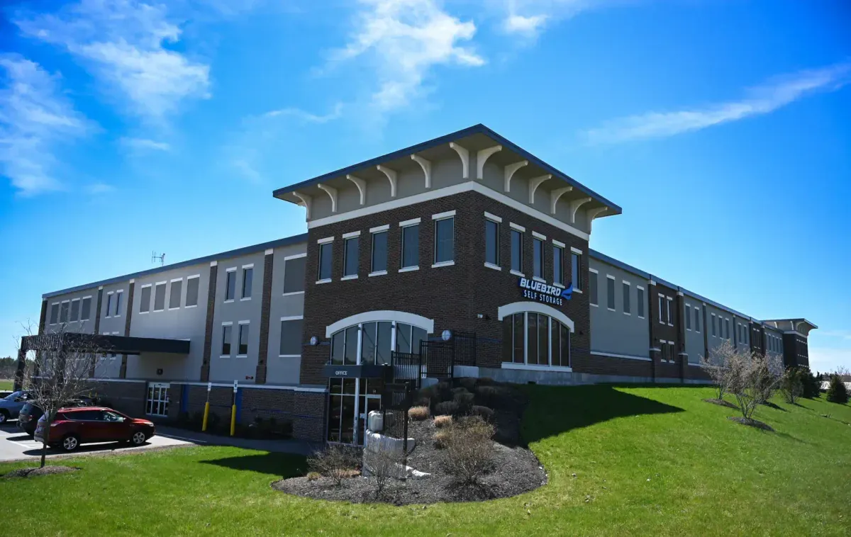 Bluebird Self Storage brick exterior with green lawn and blue sky