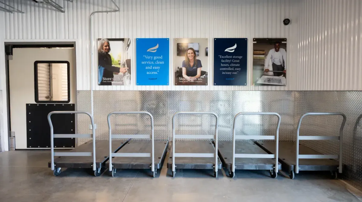 Moving carts with customer review panels on wall