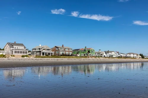 A row of houses along New Hampshire's coast on a sunny day.